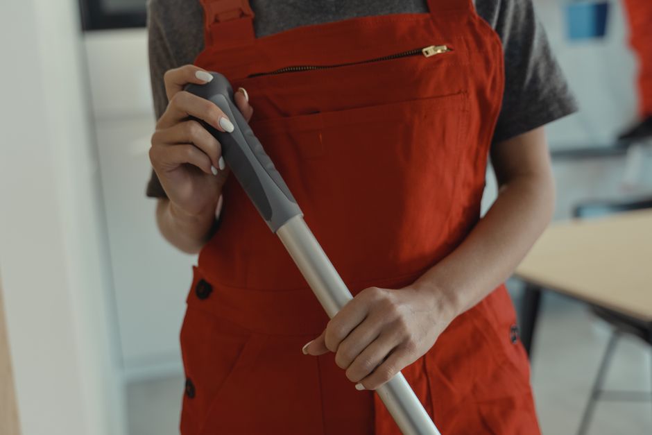 Professional cleaner demonstrating dedication to quality service